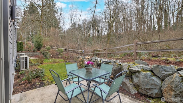 view of patio featuring fence and outdoor dining space