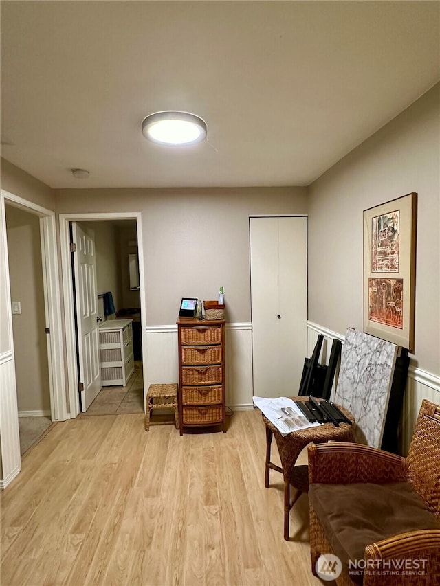 sitting room with light wood-style floors