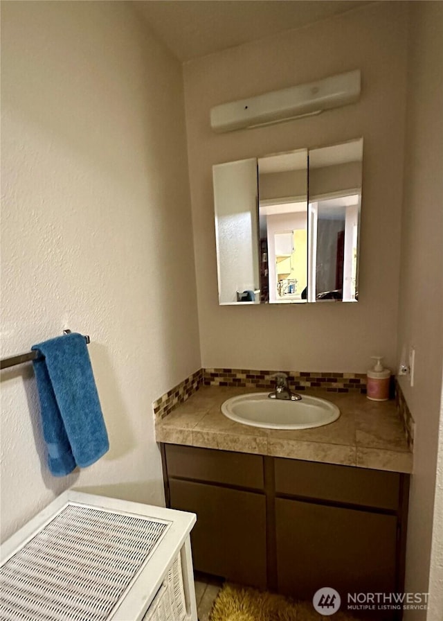 bathroom featuring backsplash and vanity