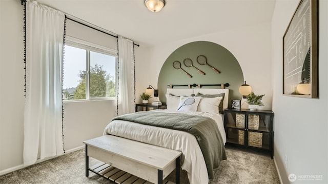 bedroom featuring carpet floors and baseboards