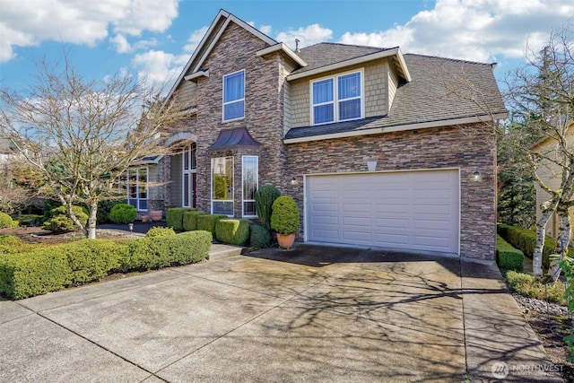 view of front of home featuring stone siding and concrete driveway