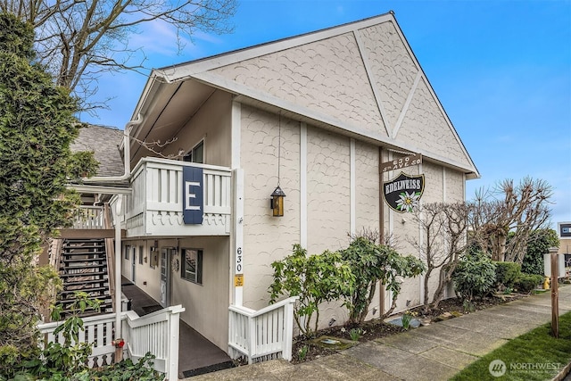 view of home's exterior featuring stairs