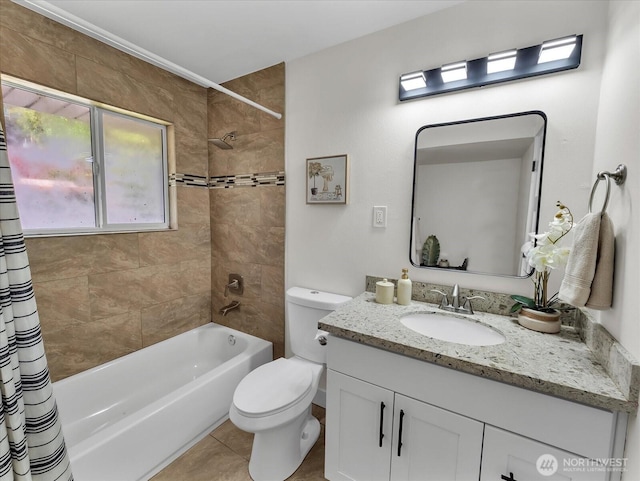 full bath with shower / bath combo, vanity, toilet, and tile patterned floors