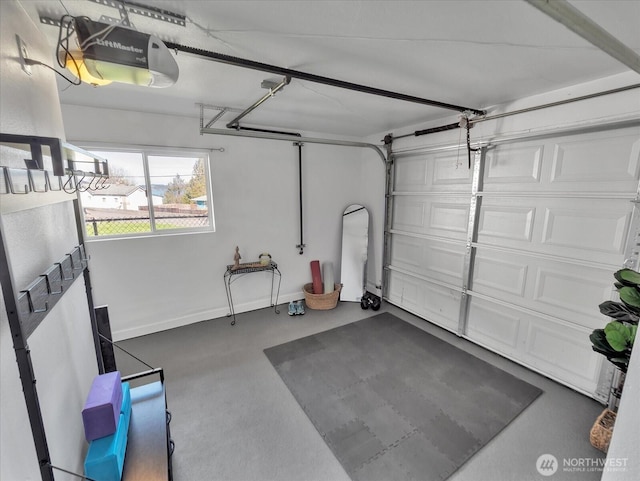 garage featuring baseboards and a garage door opener