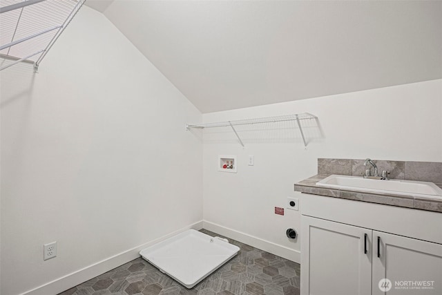 clothes washing area with baseboards, hookup for a washing machine, a sink, and hookup for an electric dryer