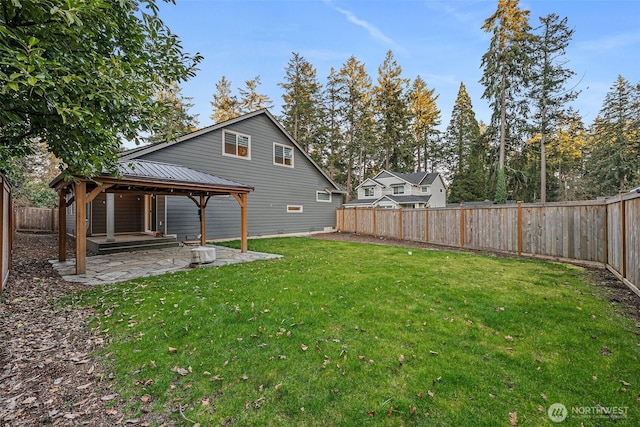 view of yard with a fenced backyard, a patio, and a gazebo