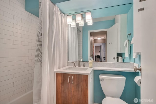 full bathroom featuring vanity, toilet, and shower / tub combo with curtain