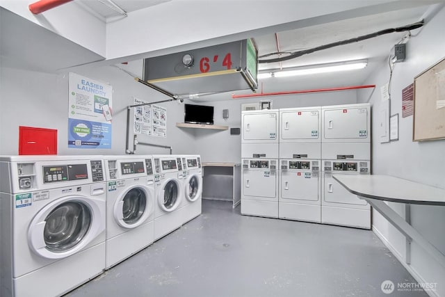 shared laundry area with stacked washer and dryer and washing machine and dryer