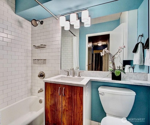 full bathroom featuring tub / shower combination, toilet, and vanity