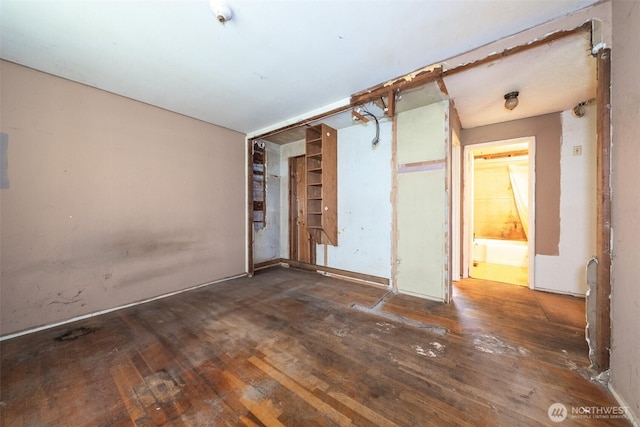 unfurnished room with wood-type flooring