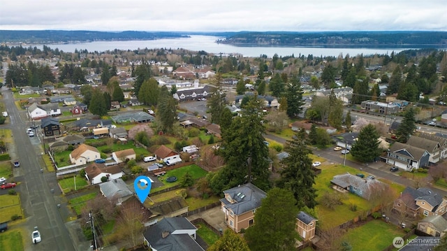 aerial view featuring a residential view and a water view