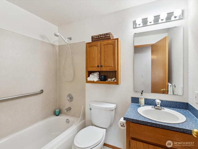 bathroom featuring vanity, bathing tub / shower combination, and toilet