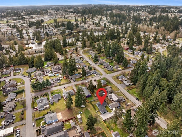 birds eye view of property featuring a residential view and a water view