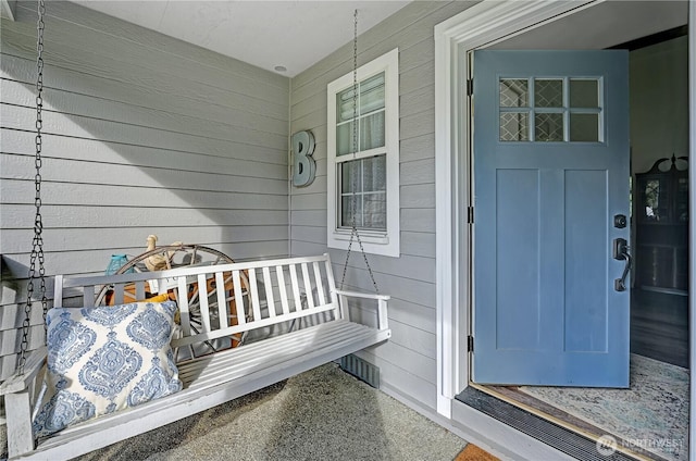 property entrance featuring a porch