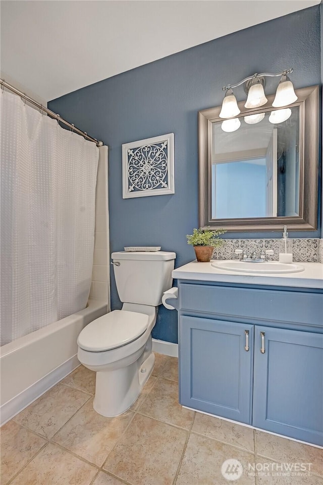 full bathroom with tile patterned flooring, baseboards, toilet, vanity, and shower / bathtub combination with curtain