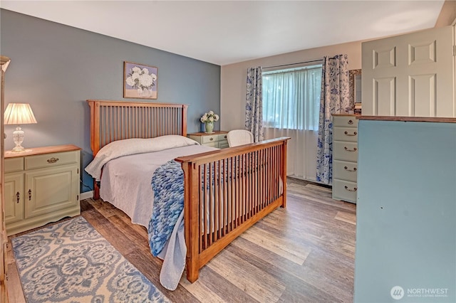 bedroom featuring light wood-style floors