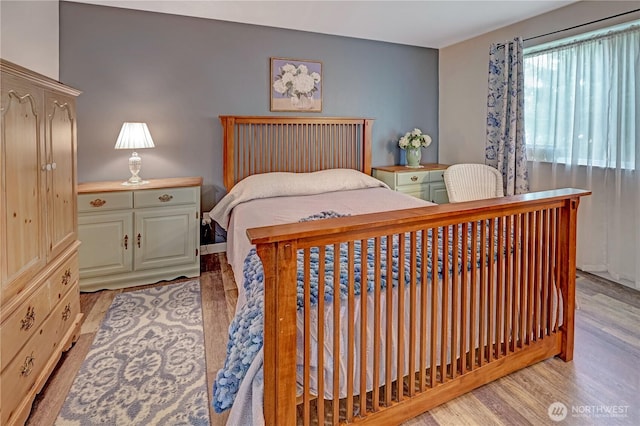 bedroom with light wood-style flooring