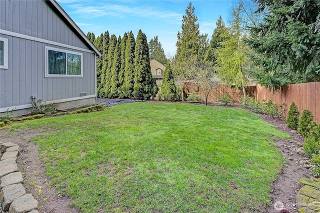 view of yard with a fenced backyard