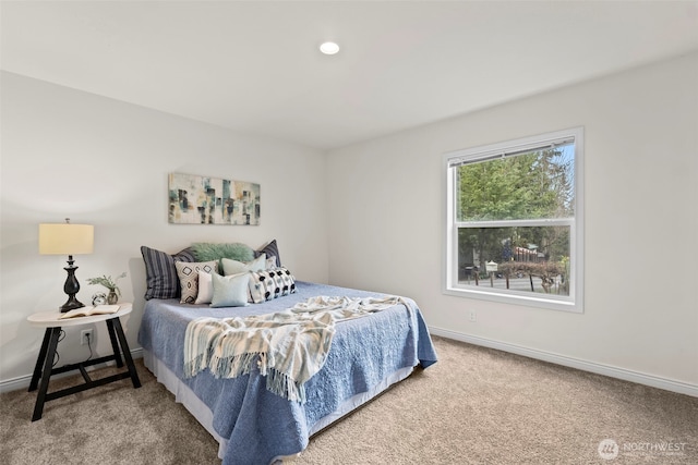 carpeted bedroom featuring recessed lighting and baseboards