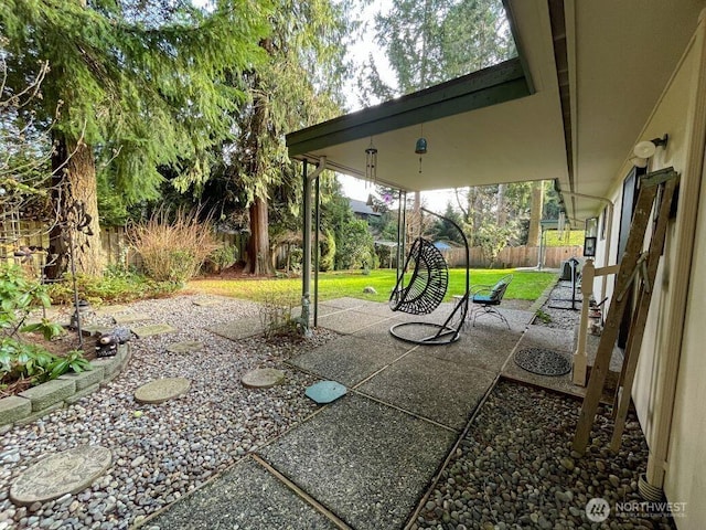 view of yard featuring a patio area and a fenced backyard