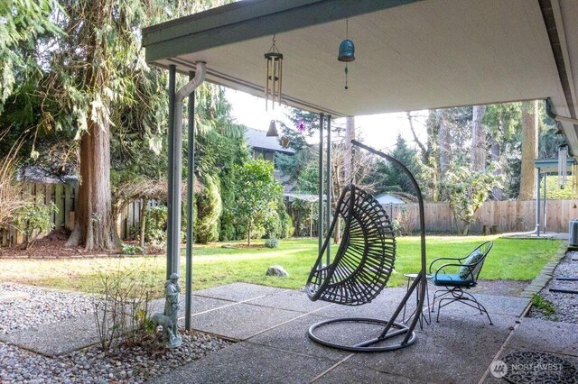 view of patio / terrace featuring fence