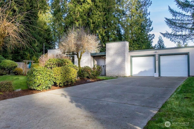 view of front of house featuring an attached garage and concrete driveway