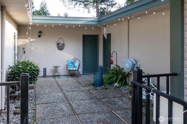 exterior space with a patio and stucco siding