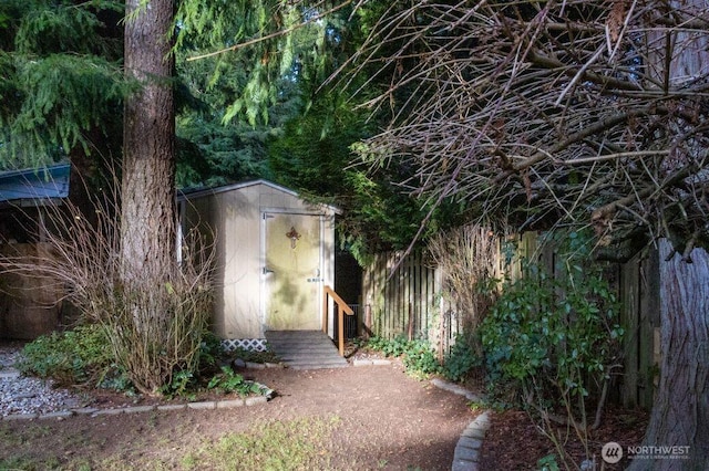 view of shed with fence