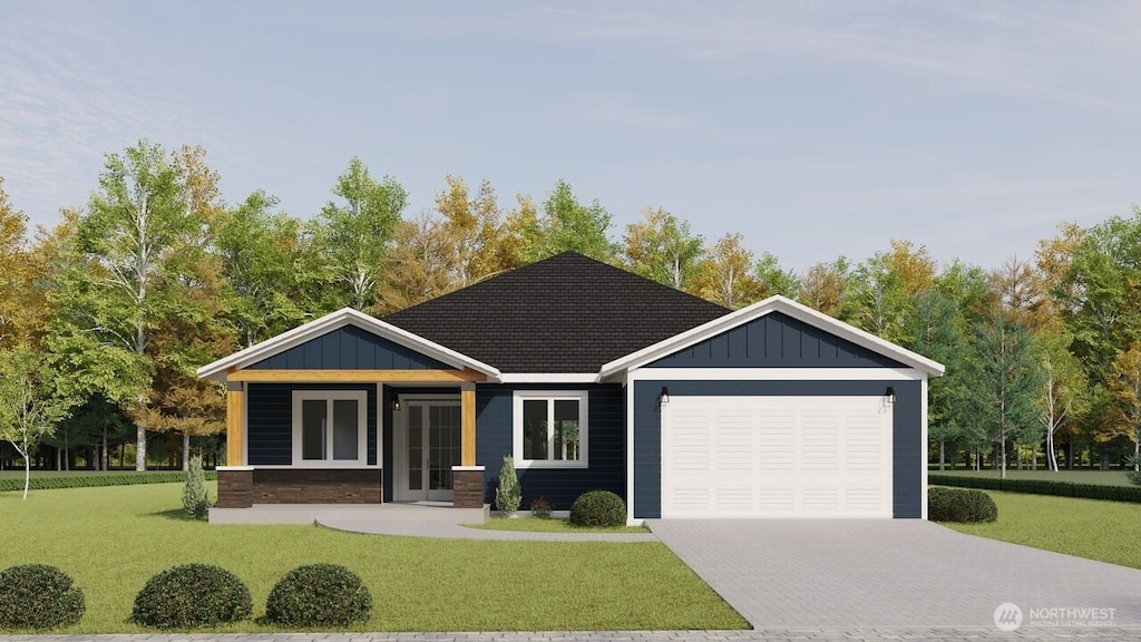 view of front of home featuring decorative driveway, an attached garage, board and batten siding, and a front lawn