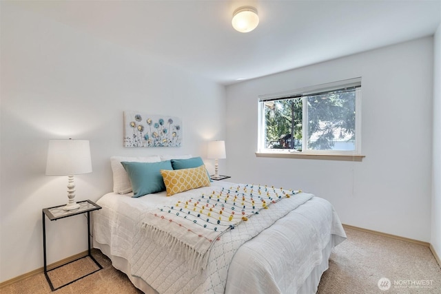 carpeted bedroom with baseboards