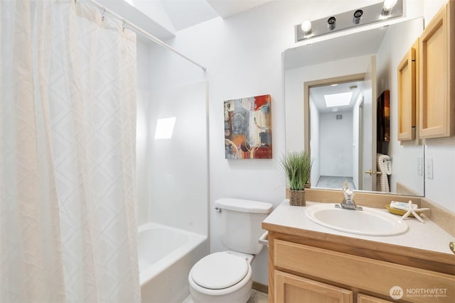 bathroom with vanity, shower / bath combination with curtain, and toilet