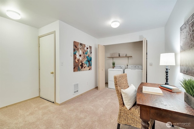 carpeted office featuring baseboards, visible vents, and washer and clothes dryer