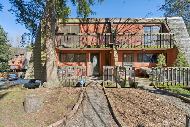 view of front of property with a balcony