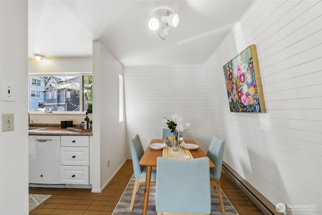 dining space with tile patterned floors and baseboards