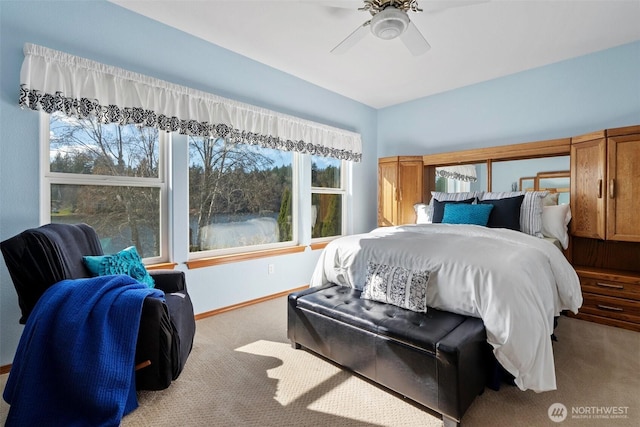 bedroom featuring ceiling fan, carpet floors, and baseboards