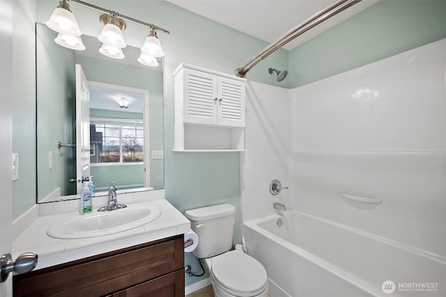 full bathroom with vanity, toilet, and washtub / shower combination