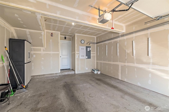 garage with electric panel and a garage door opener