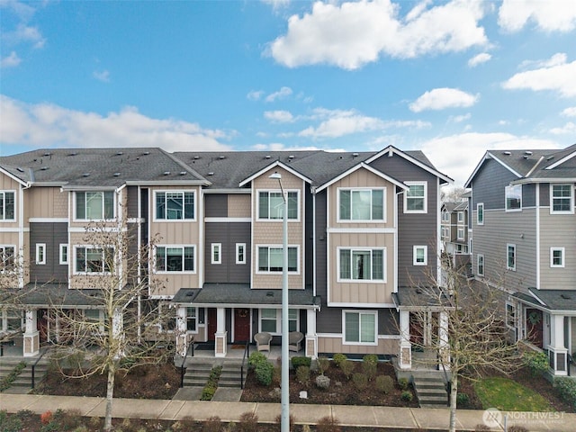 view of property featuring a residential view and board and batten siding