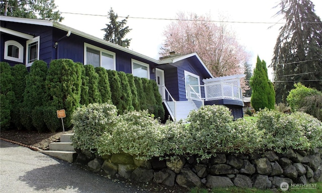 view of property exterior with stairs