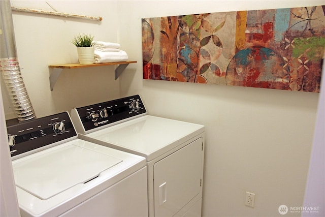 clothes washing area featuring laundry area and washing machine and clothes dryer