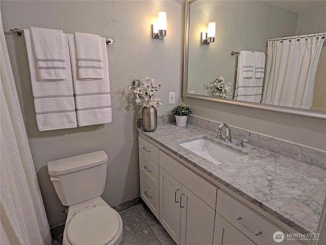 bathroom with toilet and vanity
