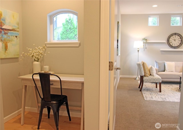 office with wood finished floors, recessed lighting, a healthy amount of sunlight, and baseboards