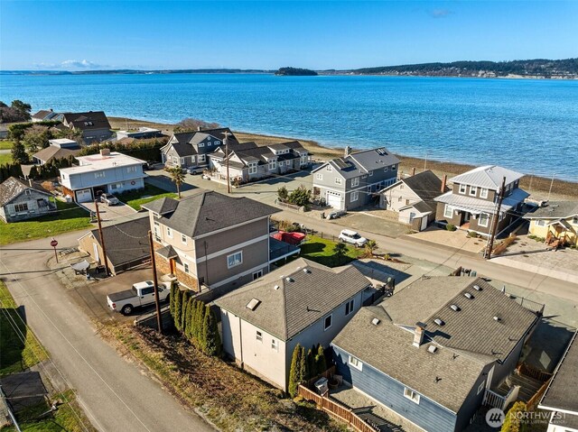 bird's eye view featuring a residential view and a water view