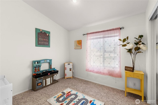 rec room featuring vaulted ceiling, carpet flooring, and baseboards