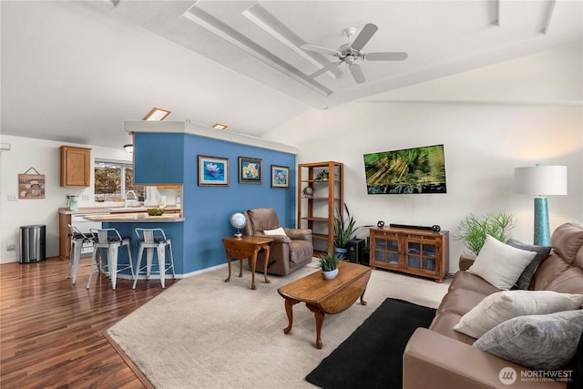 living room with dark wood-style floors, baseboards, ceiling fan, and vaulted ceiling