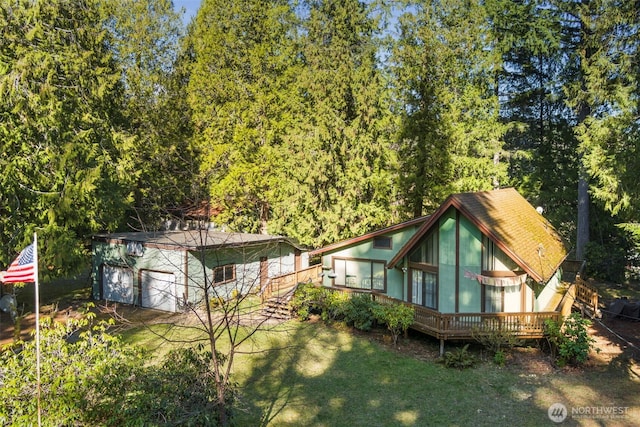 rear view of house with a yard