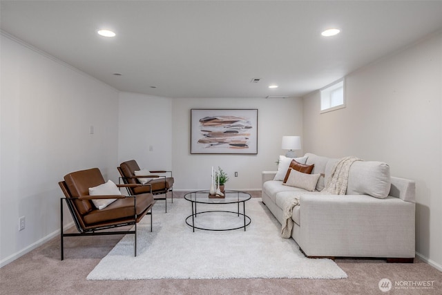 carpeted living area with recessed lighting and baseboards