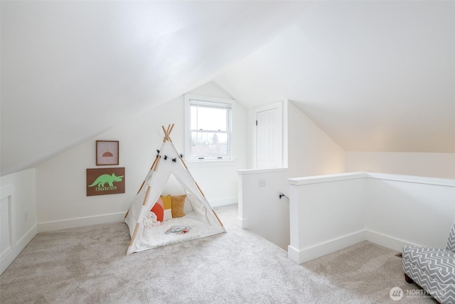 playroom with vaulted ceiling, carpet flooring, and baseboards