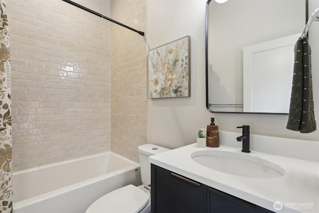 full bathroom featuring vanity, shower / tub combo, and toilet