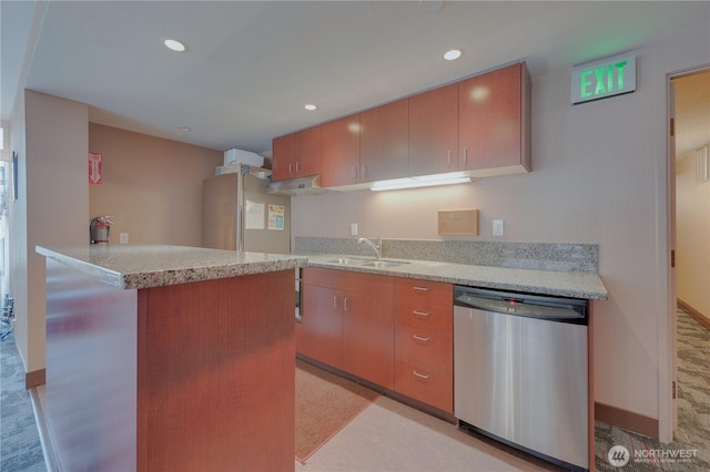 kitchen featuring a sink, fridge, stainless steel dishwasher, and recessed lighting